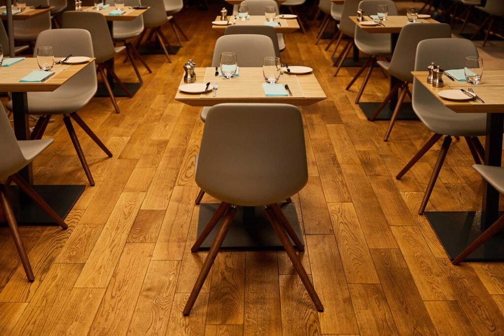 glasses-near-plates-and-napkins-on-wooden-tables-QDLUESE.jpg